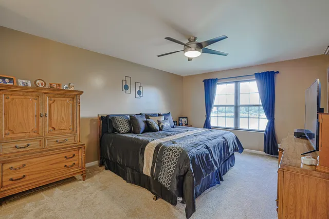 a bed room with a bed and a window