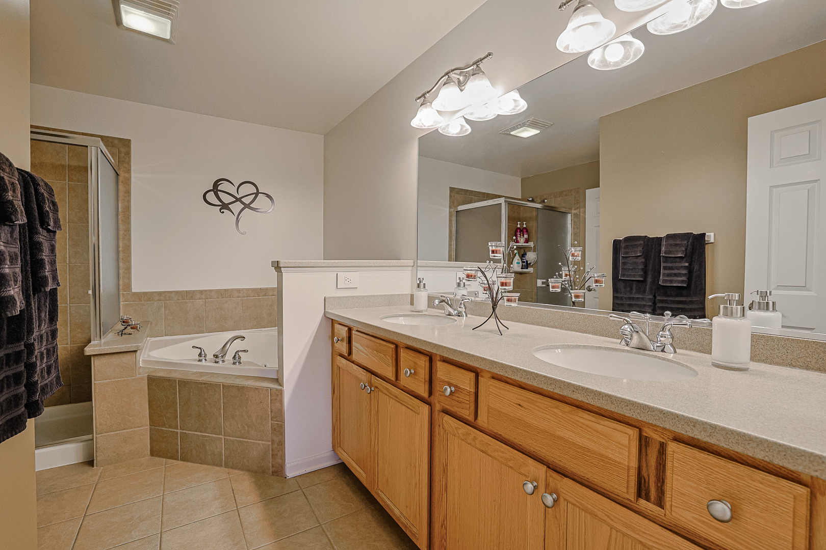 1242 Prairie View Parkway Cary, IL 60013 - Photo 25 of 36 a bathroom with a sink a vanity and a mirror