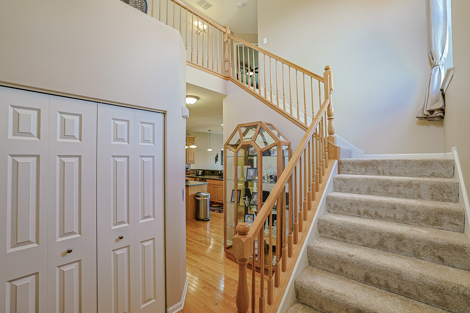 1242 Prairie View Parkway Cary, IL 60013 - Photo 3 of 36 a view of staircase with lots of frames on wall and a stairs