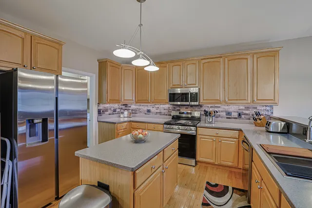 a kitchen with a sink a stove and refrigerator