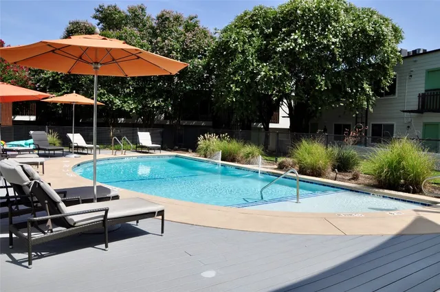 a view of a backyard with sitting area
