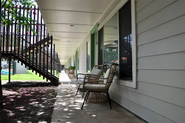a view of chairs in front of building