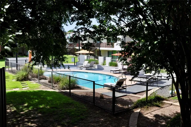 a view of a swimming pool with a patio