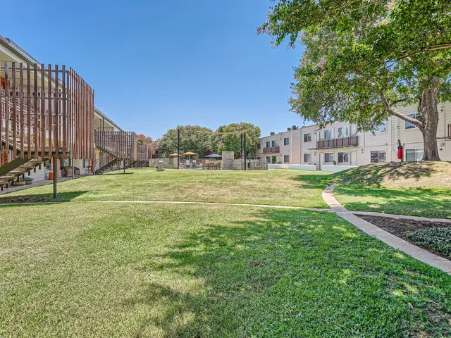 a swimming pool with outdoor seating and yard