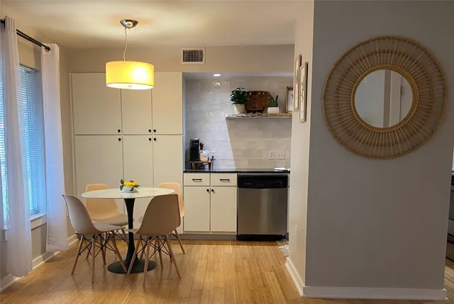 a kitchen with a table and chairs