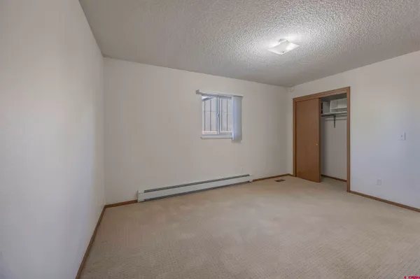 an empty room with a empty space and windows