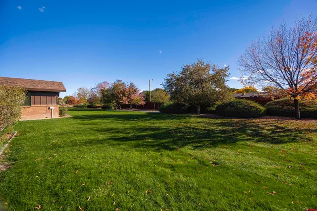 an aerial view of a house with a lake view