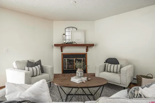 a bedroom with a bed chair and window