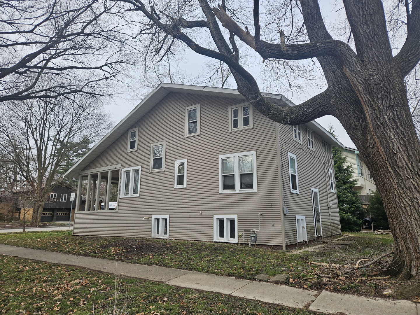 502 West John Street Champaign, IL 61820 - Photo 4 of 6 a front view of a house with a yard