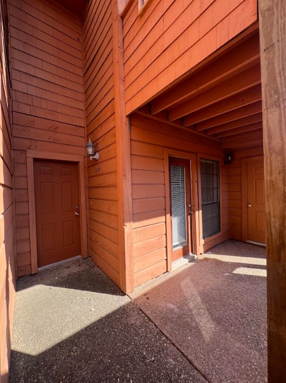 a view of front door and yard