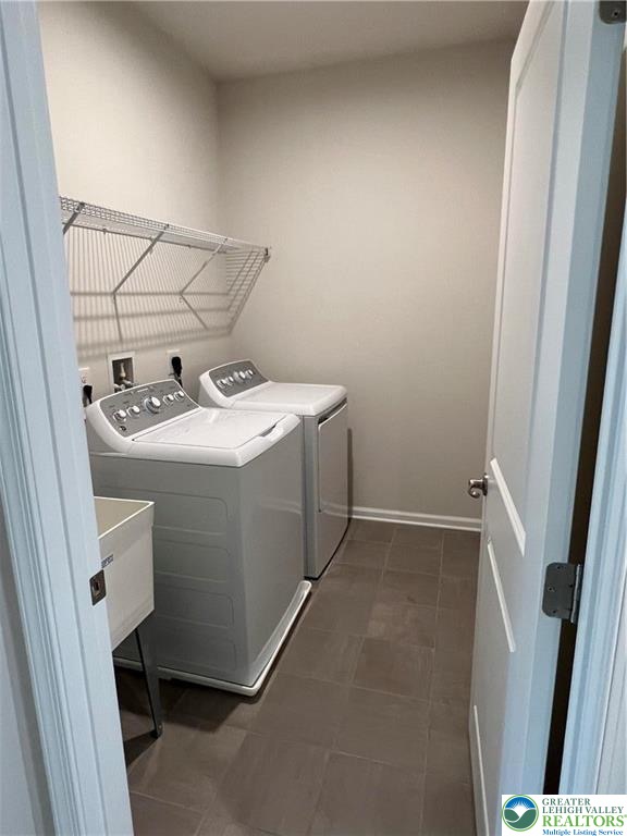 2356 Raya Way Easton, PA 18045 - Photo 20 of 28 Tiled flooring, wire shelving, and a utility sink anchor this dedicated laundry space.