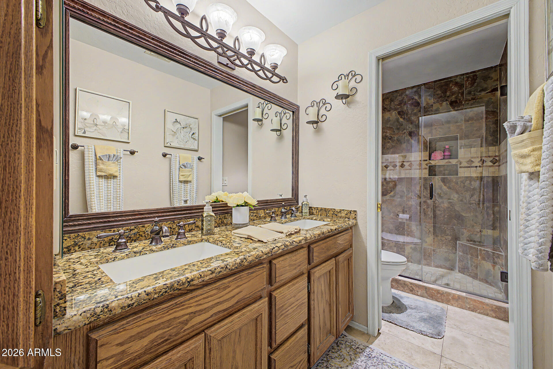1924 East El Freda Road Tempe, AZ 85284 - Photo 37 of 56 a bathroom with a granite countertop sink and a mirror