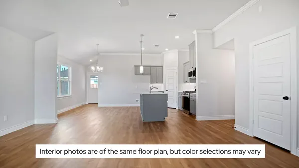 a kitchen with kitchen island a sink stainless steel appliances and cabinets