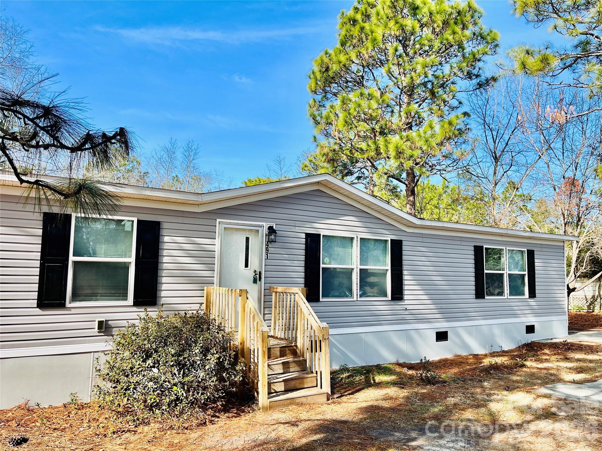 491 Sandy Springs Lane Lexington, SC 29073 - Photo 2 of 36 a front view of a house with a tree