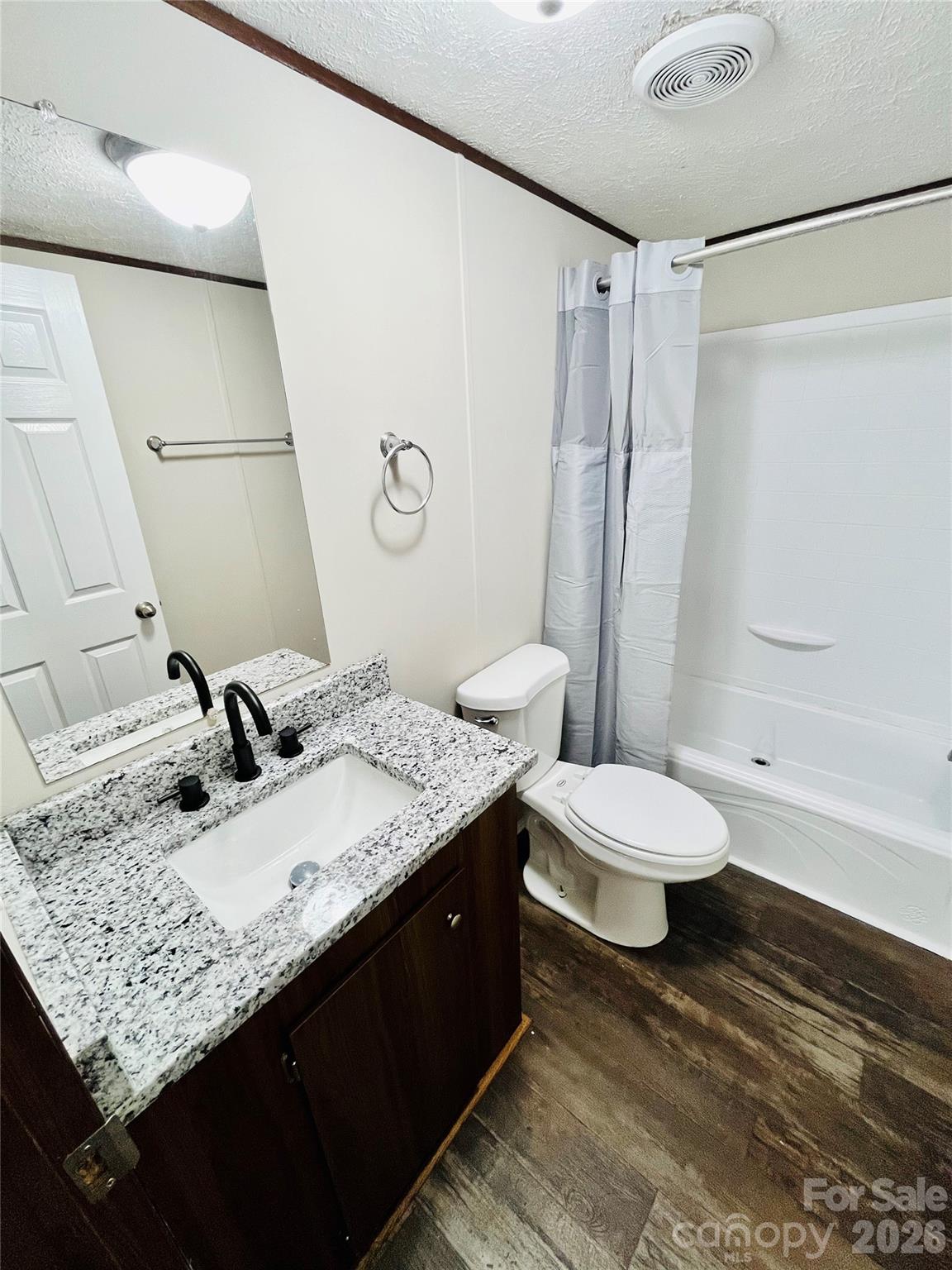 491 Sandy Springs Lane Lexington, SC 29073 - Photo 29 of 36 a bathroom with a granite countertop sink toilet and shower