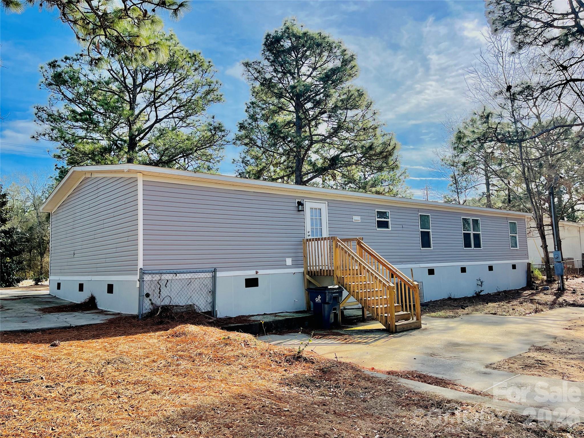 491 Sandy Springs Lane Lexington, SC 29073 - Photo 32 of 36 a view of a house with a yard and wooden fence