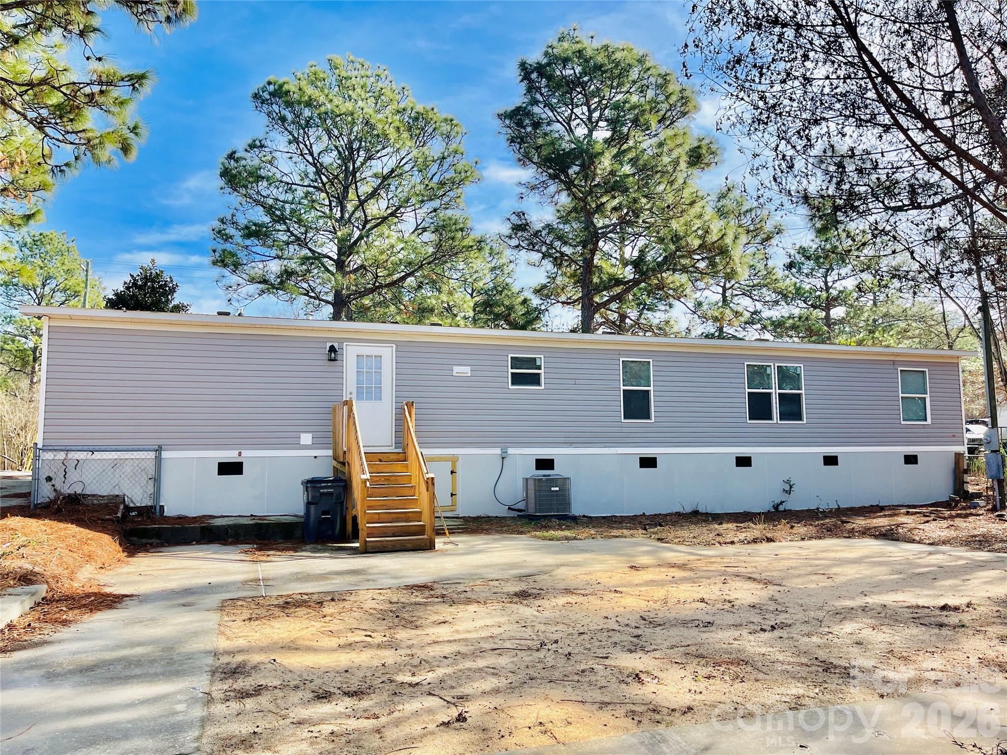 491 Sandy Springs Lane Lexington, SC 29073 - Photo 33 of 36 a view of a house with a backyard