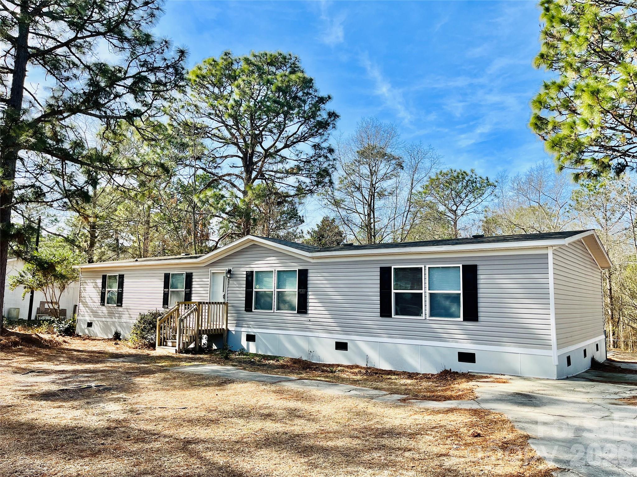 491 Sandy Springs Lane Lexington, SC 29073 - Photo 5 of 36 a front view of a house with a yard