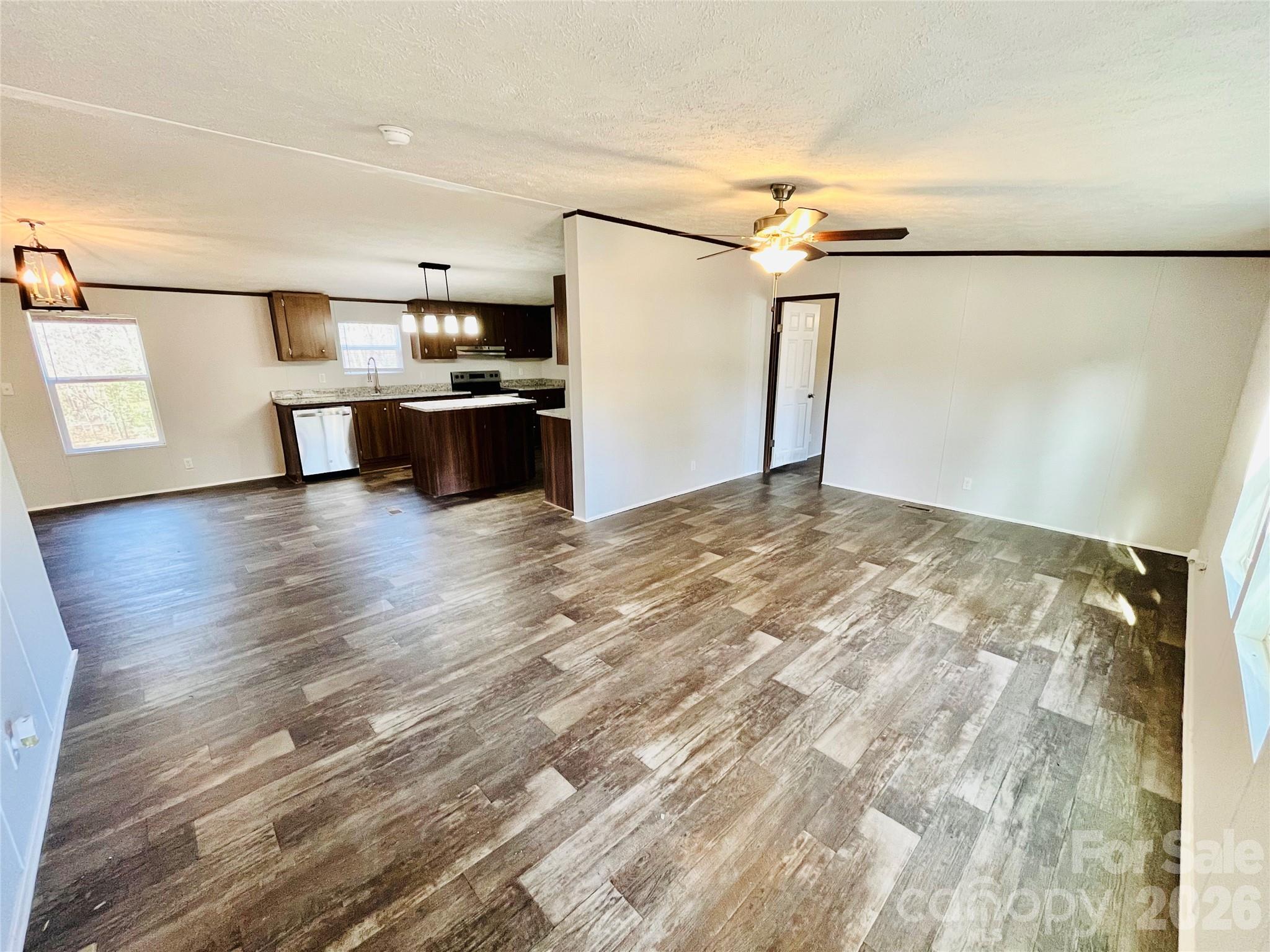 491 Sandy Springs Lane Lexington, SC 29073 - Photo 7 of 36 a view of a kitchen with a sink and refrigerator