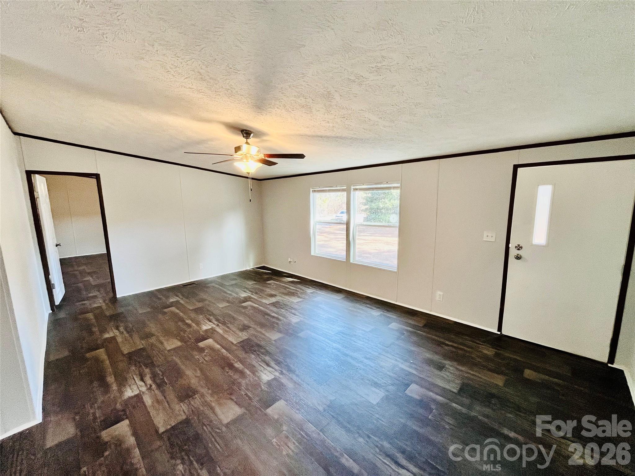 491 Sandy Springs Lane Lexington, SC 29073 - Photo 8 of 36 a view of empty room with wooden floor and fan