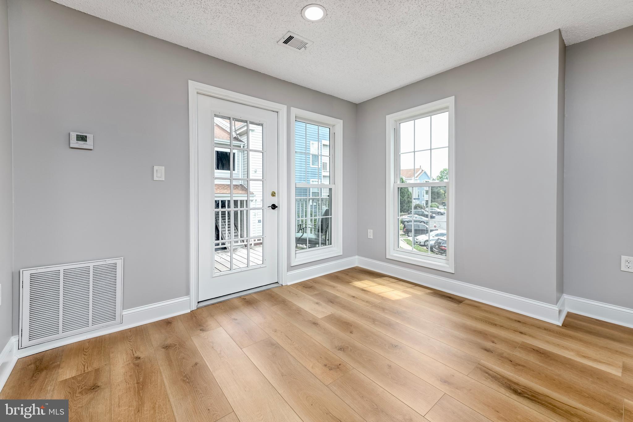 20991 Timber Ridge Terrace, Unit 204 Ashburn, VA 20147 - Photo 7 of 27 Dining Room - entrance to Balcony