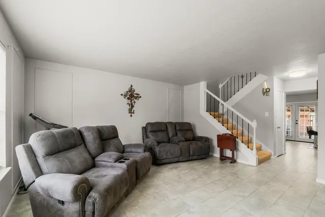 a view of a livingroom with furniture and a flat screen tv