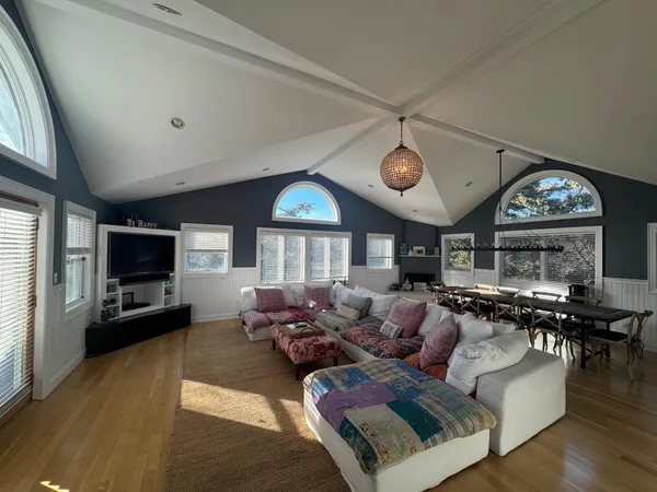 a living room with fireplace furniture and a flat screen tv