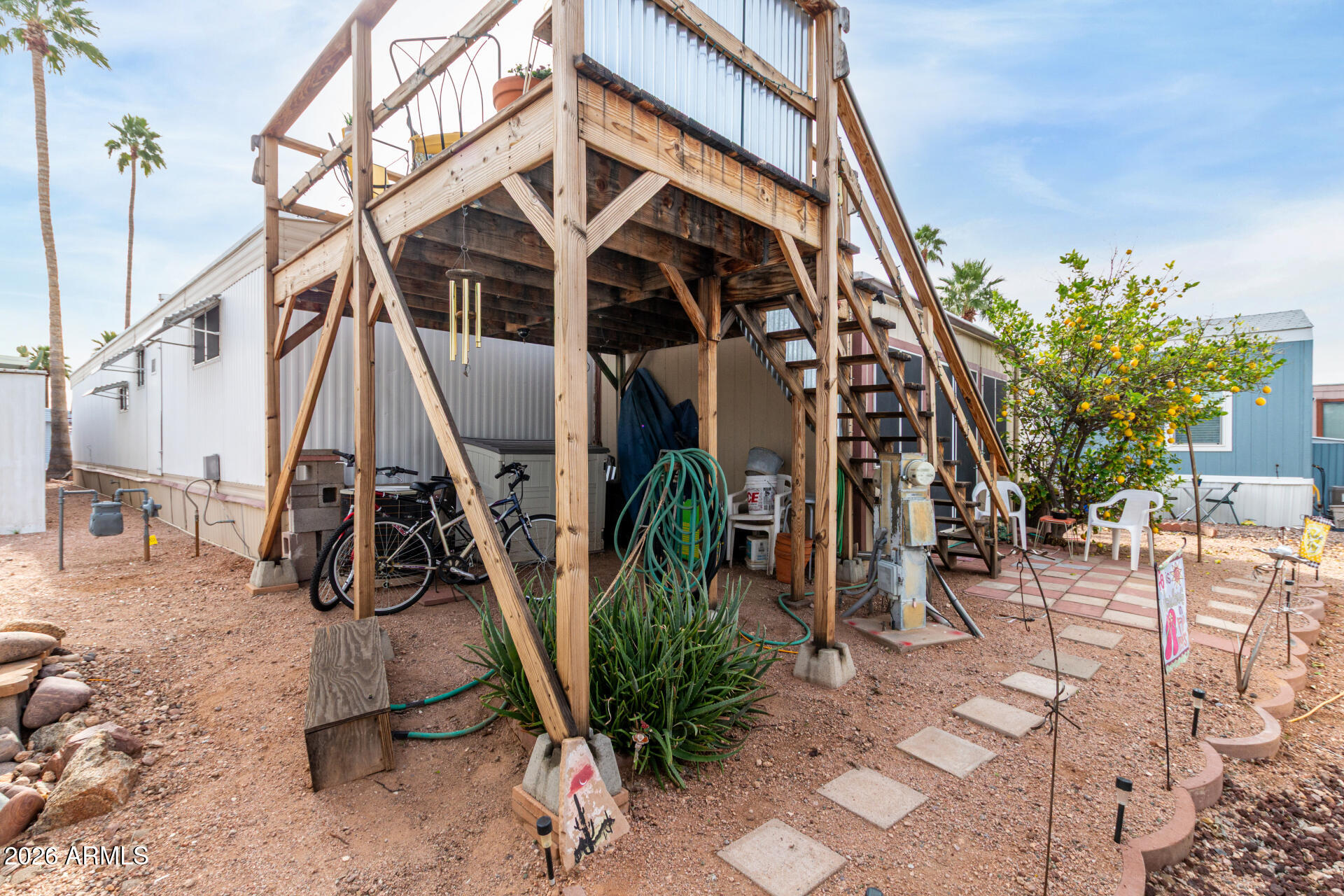 800 West Apache Trail, Unit 93 Apache Junction, AZ 85120 - Photo 28 of 28 a view of a chairs with wooden fence