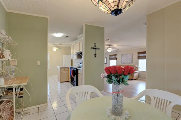 a view of living room filled with furniture and a chandelier
