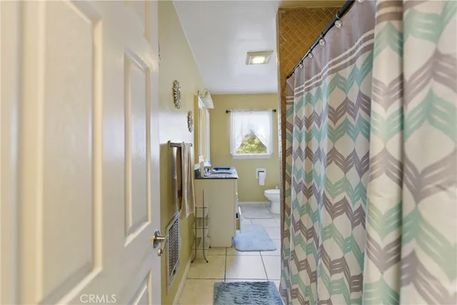 a bathroom with a shower and a sink