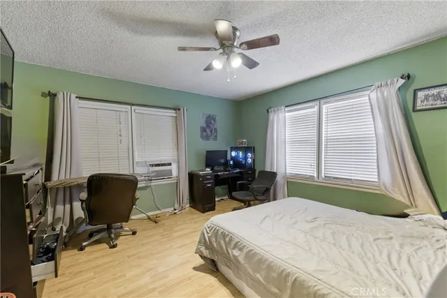 a bedroom with a bed and a chair