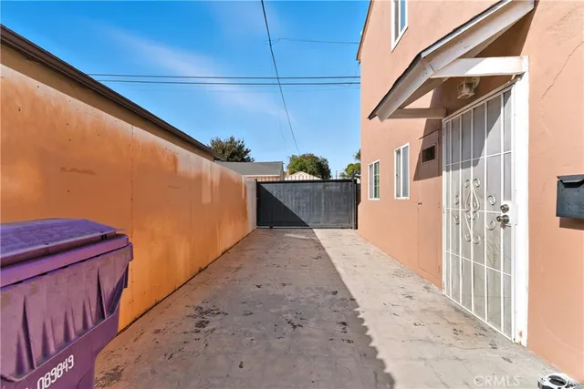 a view of a patio with wooden fence