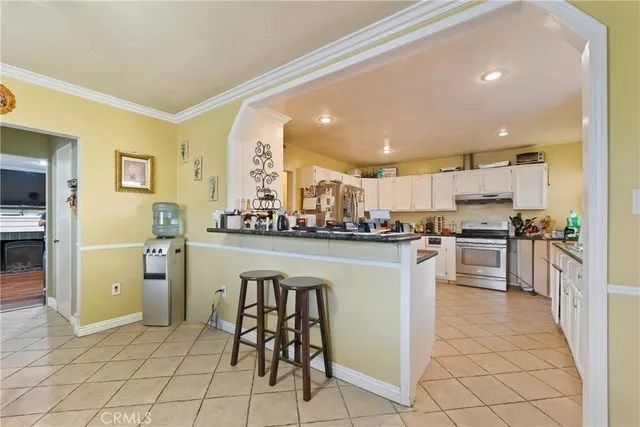 a kitchen with a refrigerator and a sink