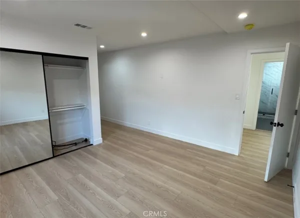 a view of a kitchen with a sink and a refrigerator
