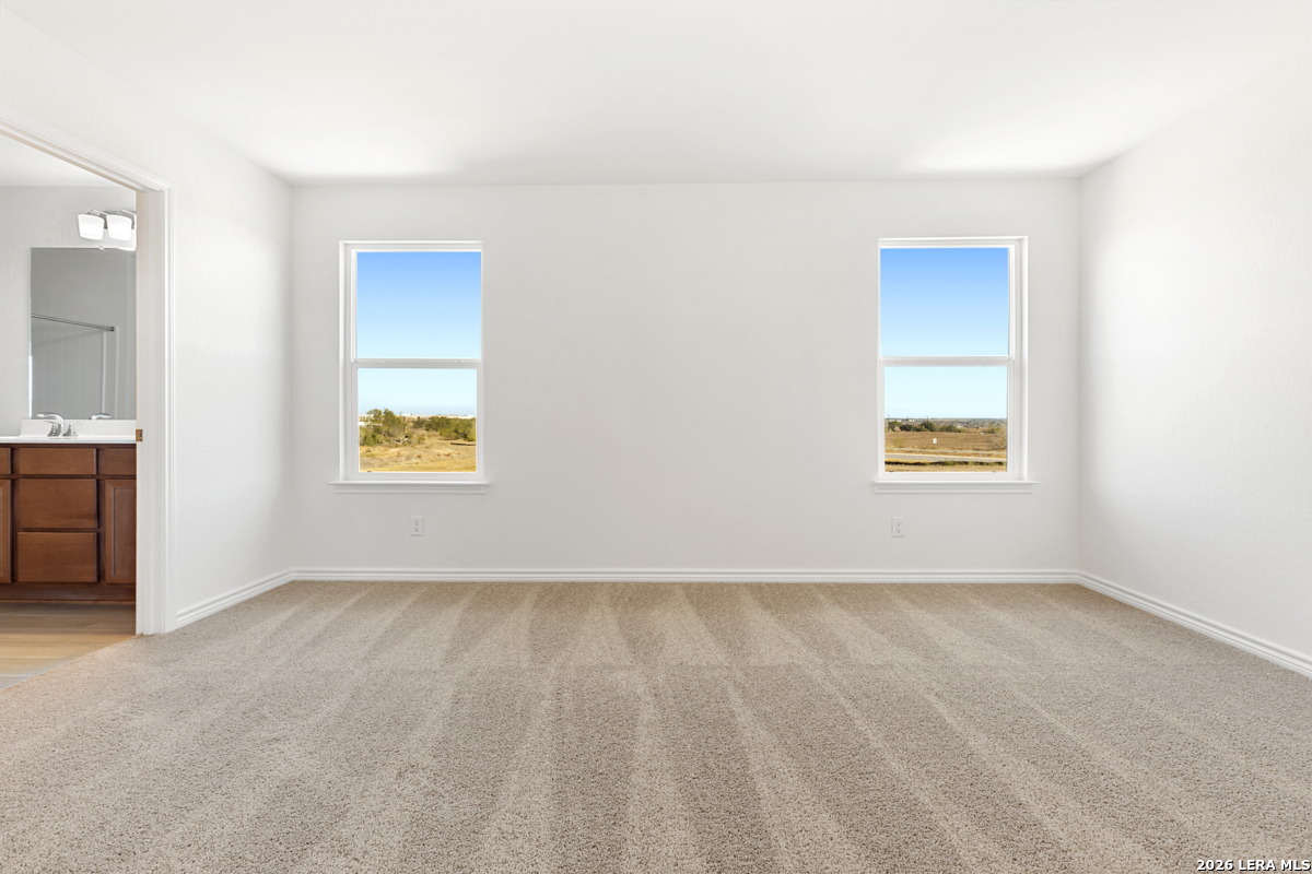 10045 Jagger Avenue Converse, TX 78109 - Photo 17 of 28 an empty room with windows and closet