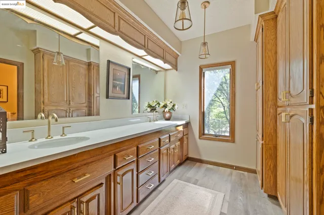 a bedroom with a bed and a television