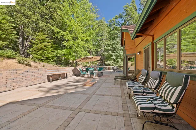a view of a patio with a table and chairs