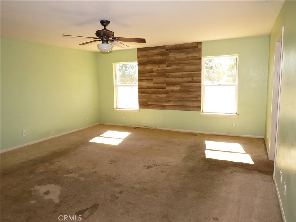 9951 Arrowhead Road Phelan, CA 92371 - Photo 13 of 21 a view of an empty room and a window