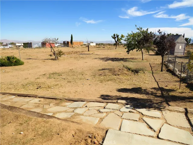 a view of a backyard of the house