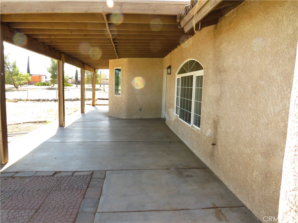 9951 Arrowhead Road Phelan, CA 92371 - Photo 7 of 21 a view of a hallway with wooden floor