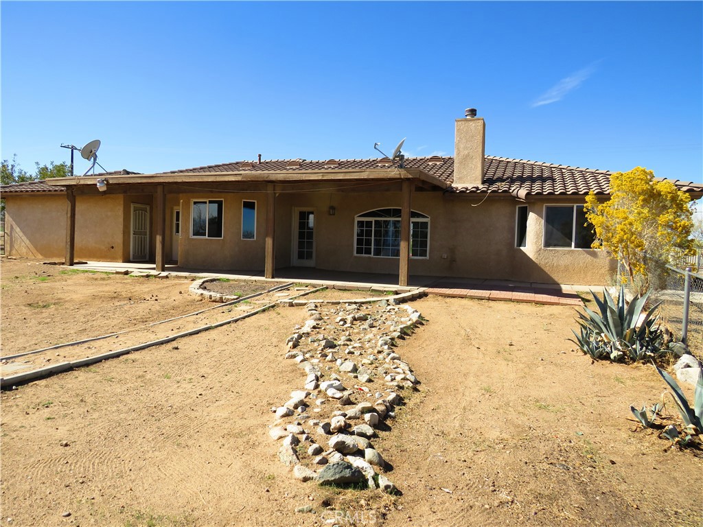 9951 Arrowhead Road Phelan, CA 92371 - Photo 8 of 21 a front view of a house with a yard