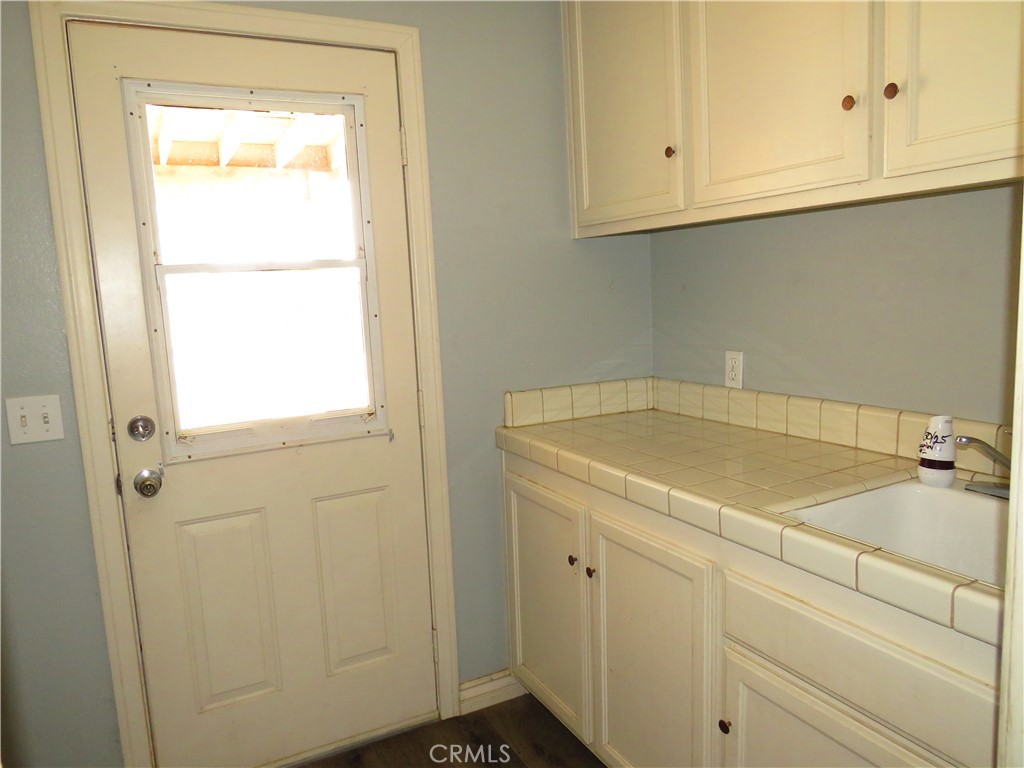 9951 Arrowhead Road Phelan, CA 92371 - Photo 10 of 21 a bathroom with a sink and cabinets
