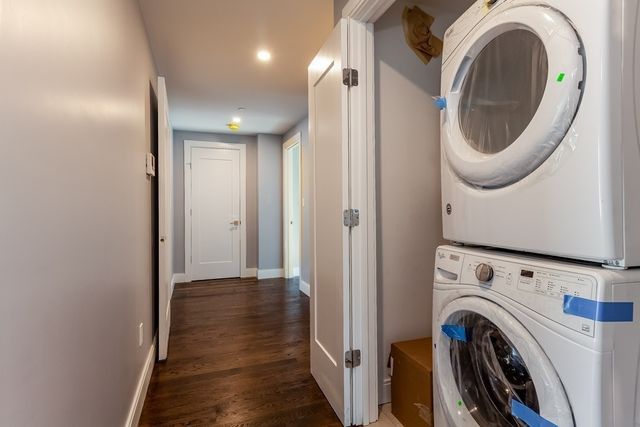 a view of a hallway with washer and dryer