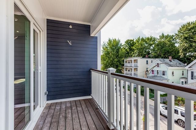 a view of a wooden fence and a yard