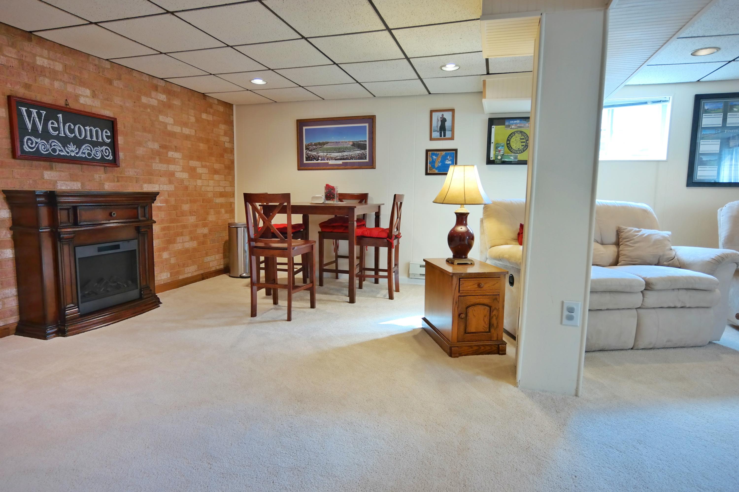 5726 Cove Road Roanoke, VA 24019 - Photo 19 of 34 a living room with furniture and a fireplace