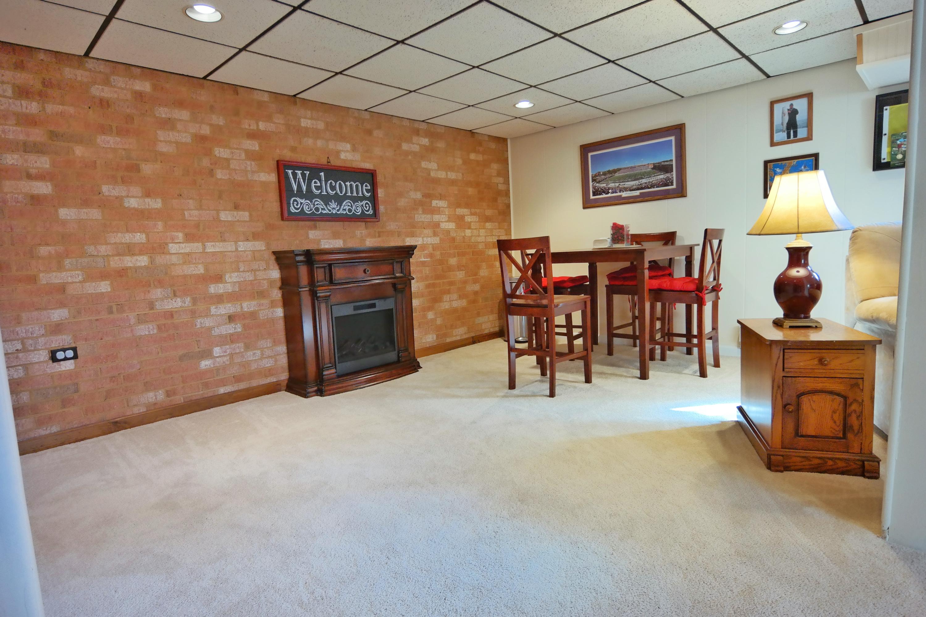 5726 Cove Road Roanoke, VA 24019 - Photo 20 of 34 a view of a livingroom with furniture flat screen tv and couches