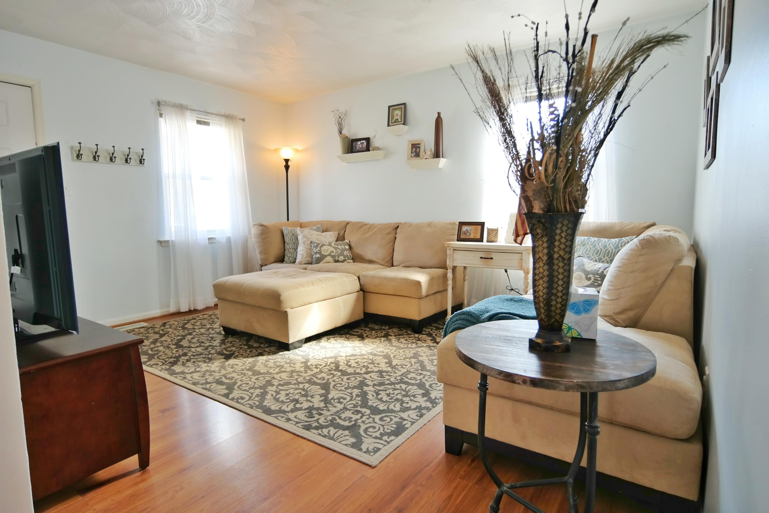 5726 Cove Road Roanoke, VA 24019 - Photo 3 of 34 a living room with furniture and a flat screen tv