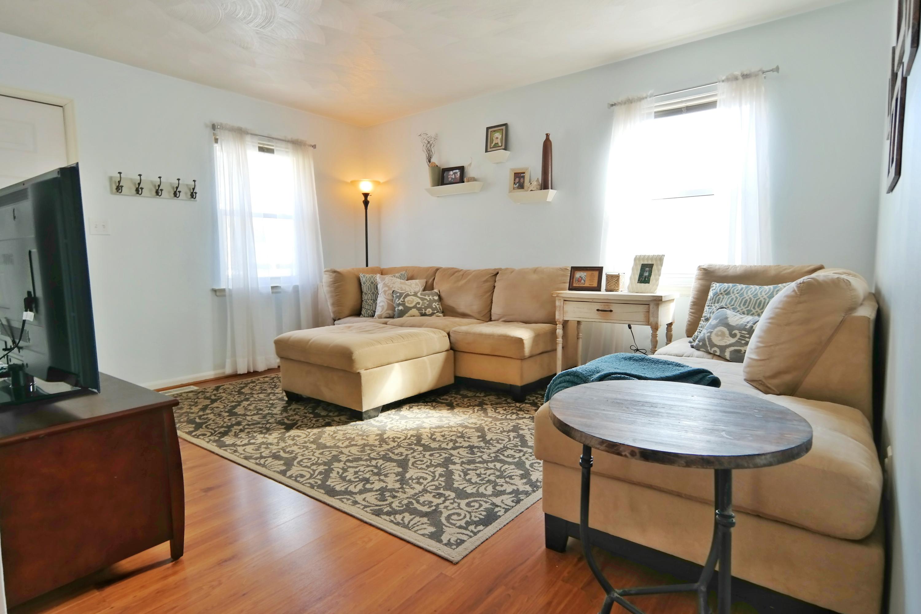 5726 Cove Road Roanoke, VA 24019 - Photo 4 of 34 a living room with furniture and a flat screen tv