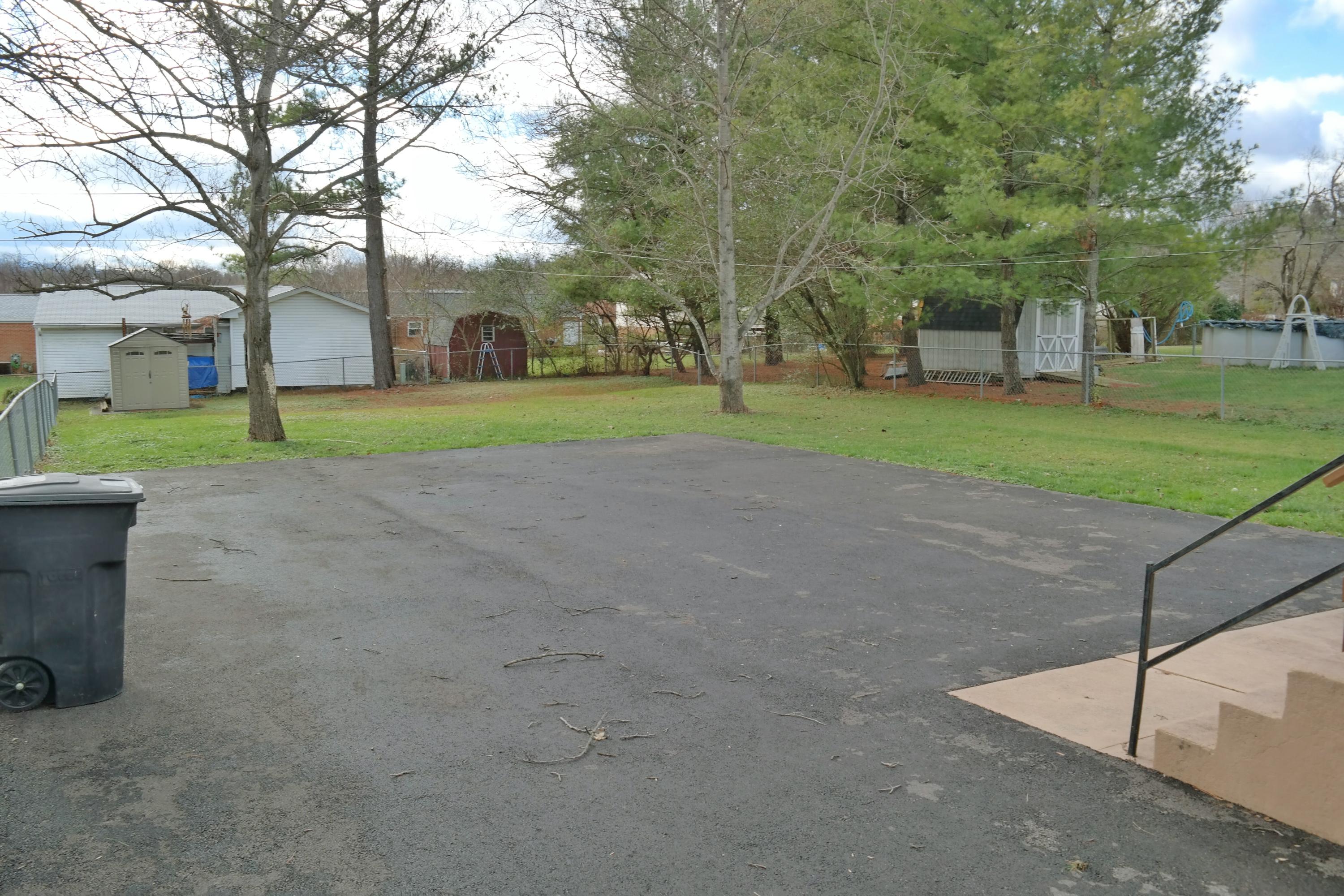 5726 Cove Road Roanoke, VA 24019 - Photo 31 of 34 a view of a house with a big yard and large trees