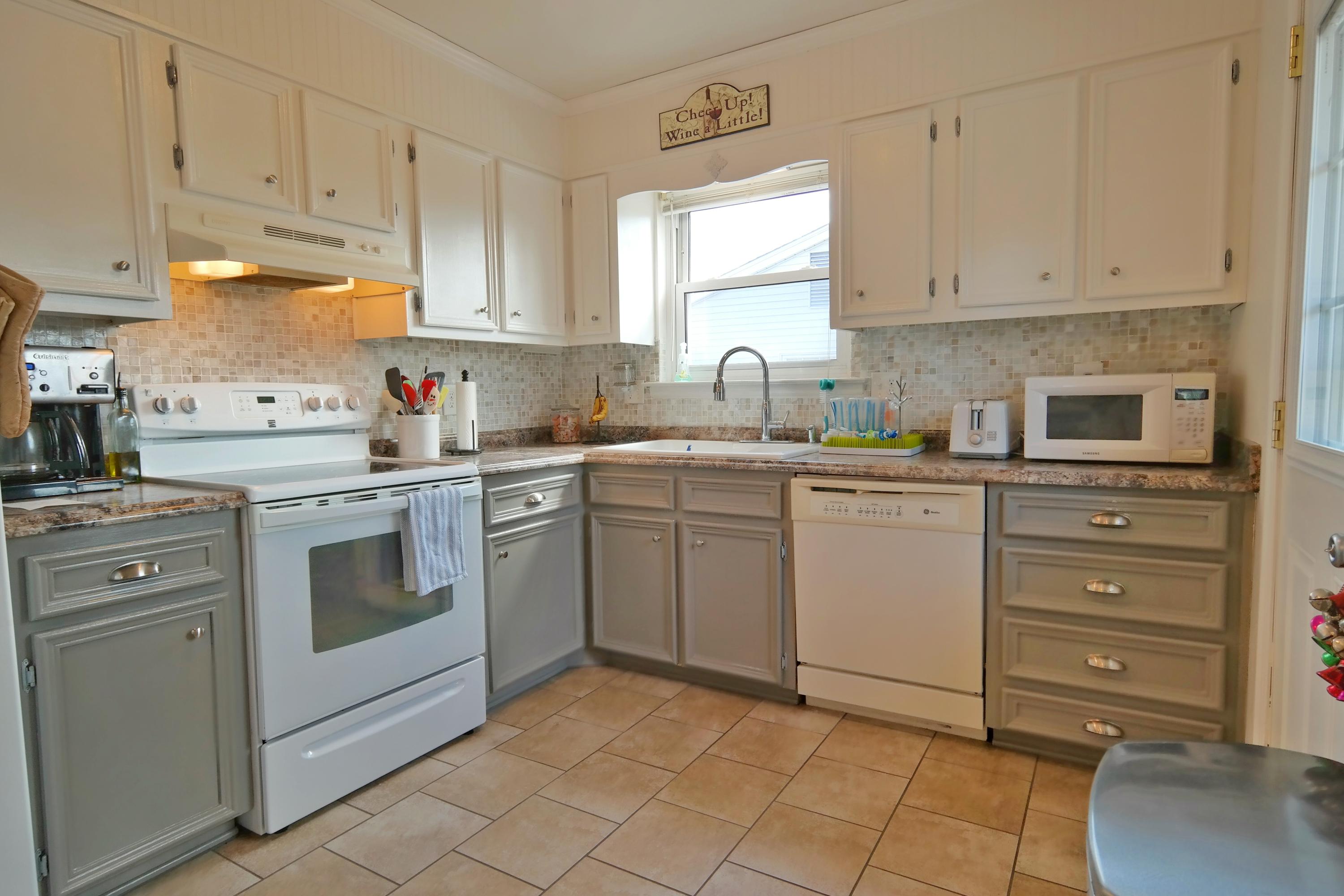 5726 Cove Road Roanoke, VA 24019 - Photo 6 of 34 a kitchen with cabinets appliances a sink and a window